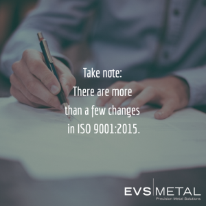 Man taking note of ISO 9001:2015 changes