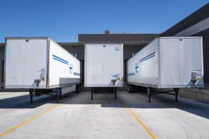 semi trucks at warehouse for shipping and receiving