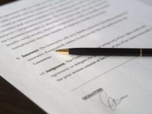 image of a contract being signed